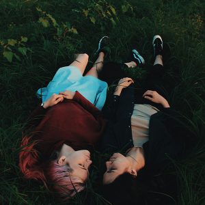 Youth sexual health resources, young couple laying in grass