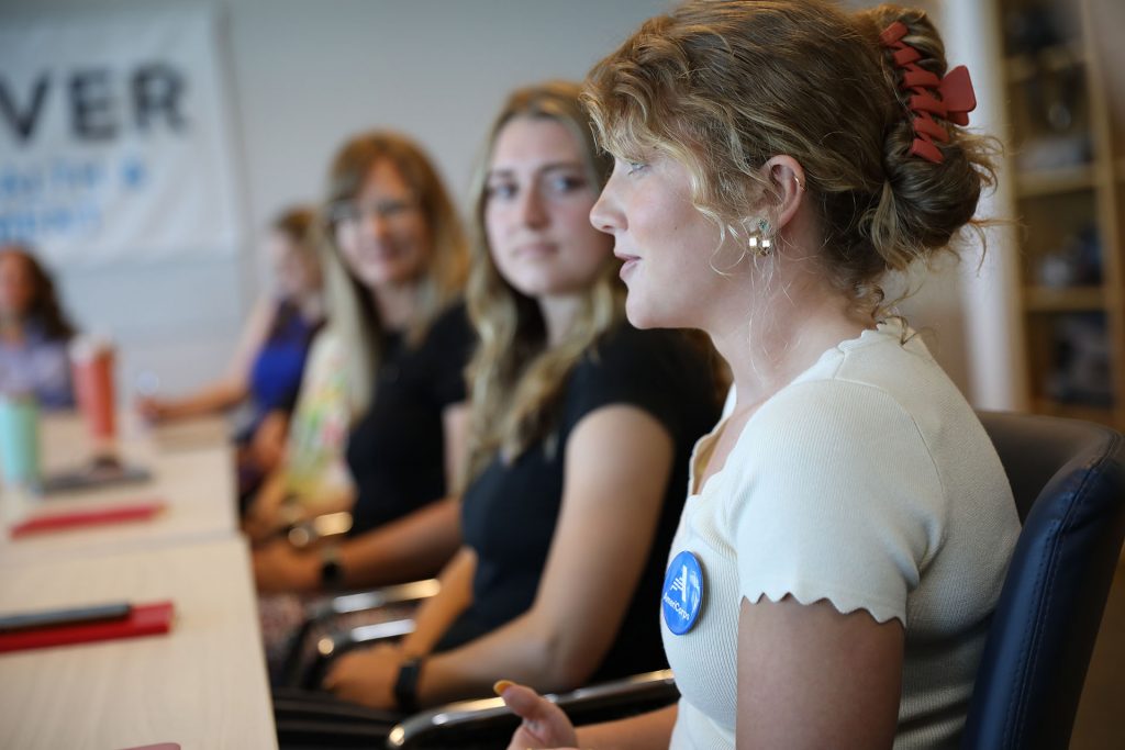 EmilyEvans_PHAmeriCorps_ColoradoPublicHealthWorks Public Health AmeriCorps member Emily Evans sits with fellow program members at a meeting at the Denver Department of Public Health and Environment