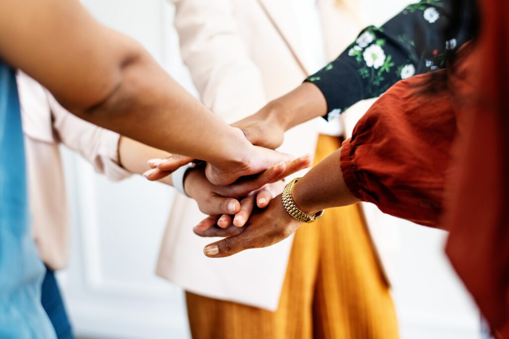 Diverse group of women hands in stack for teamwork. Women hands in stack for teamwork. Group of businesswomen hands in stack for teamwork. Women team hands in stack for teamwork