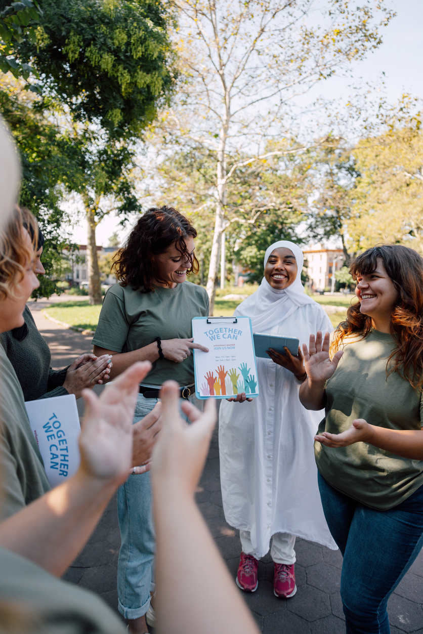Charitable foundation giving their help in a New York City neighborhood, collecting food and clothes.
