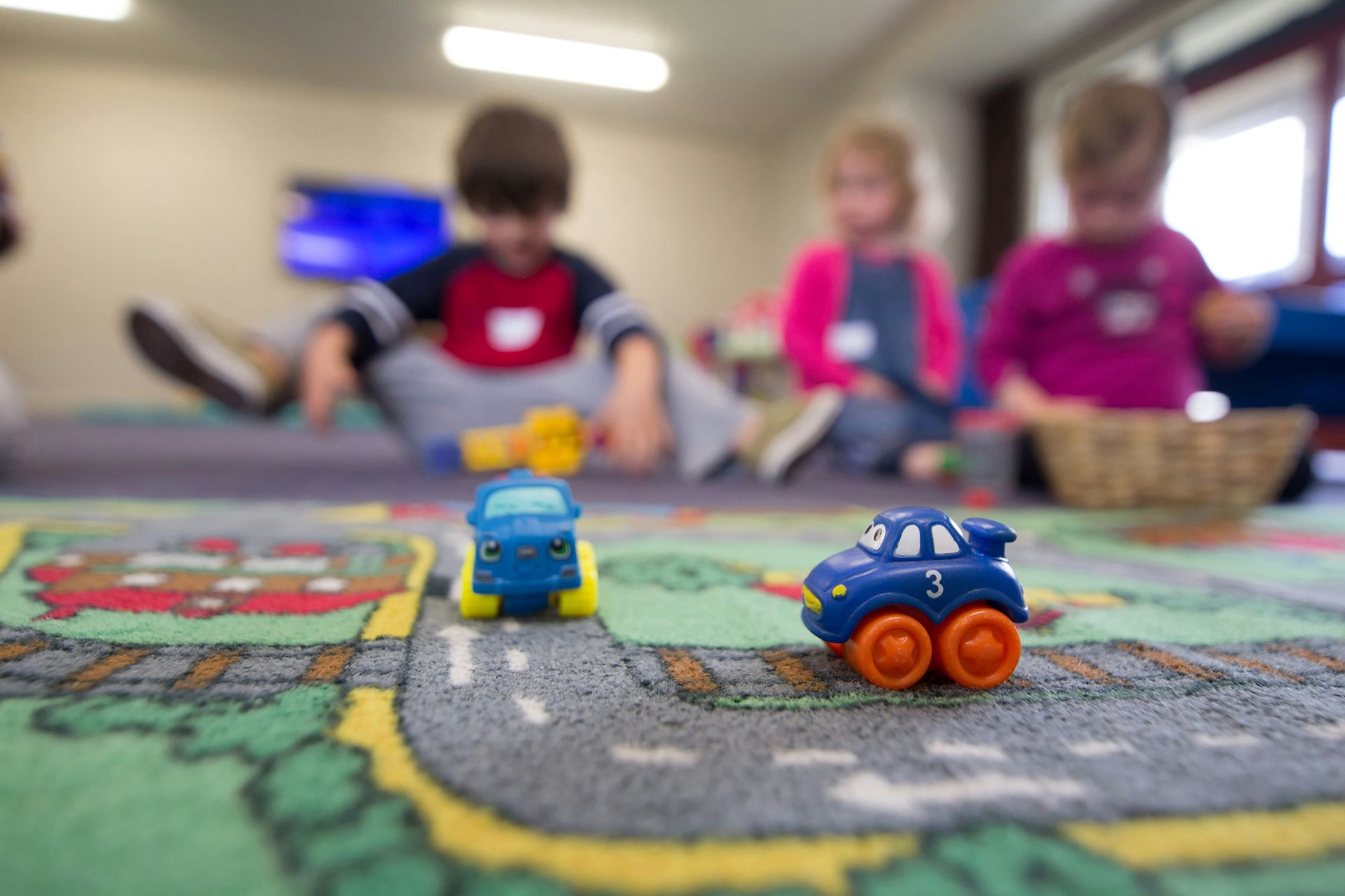 Toy cars on a playmat
